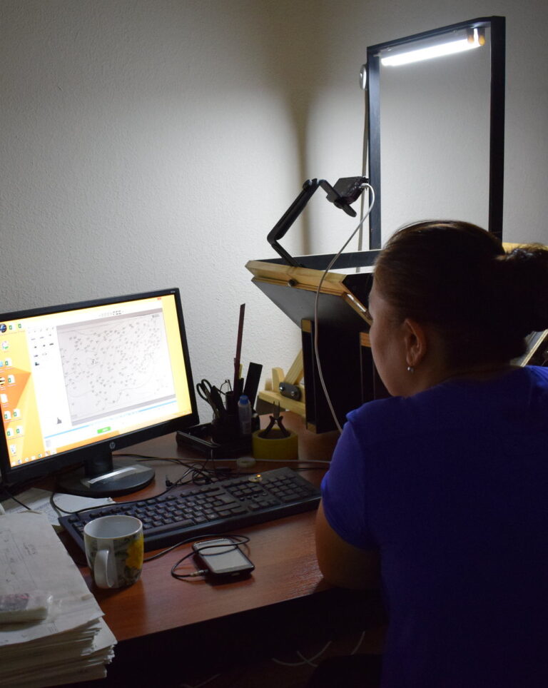 Woman at scanning workstation in Uzbekistan, by Randy McCracken
